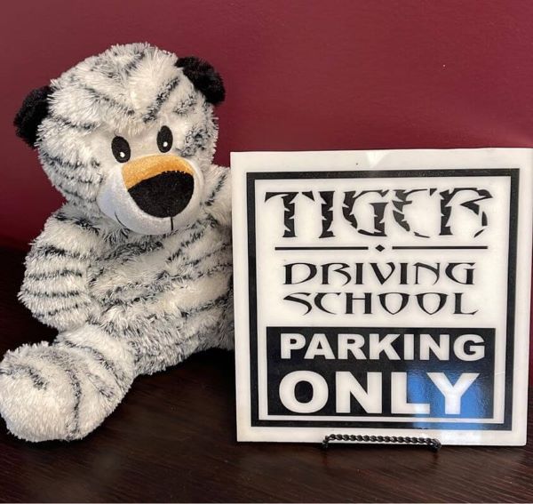 Tiger Driving School parking sign